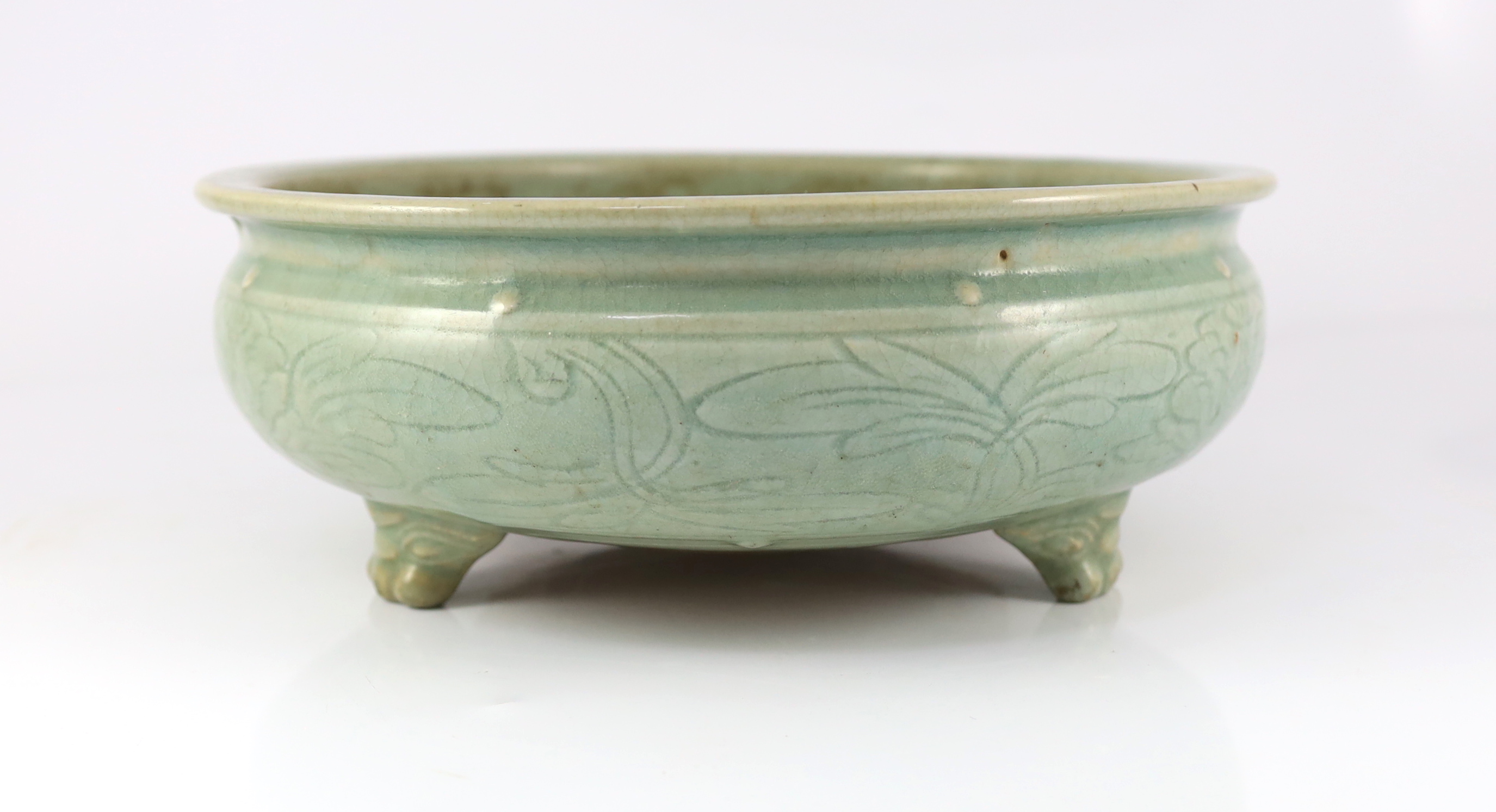 A large Chinese Longquan celadon ‘magnolia’ tripod censer, Ming dynasty
